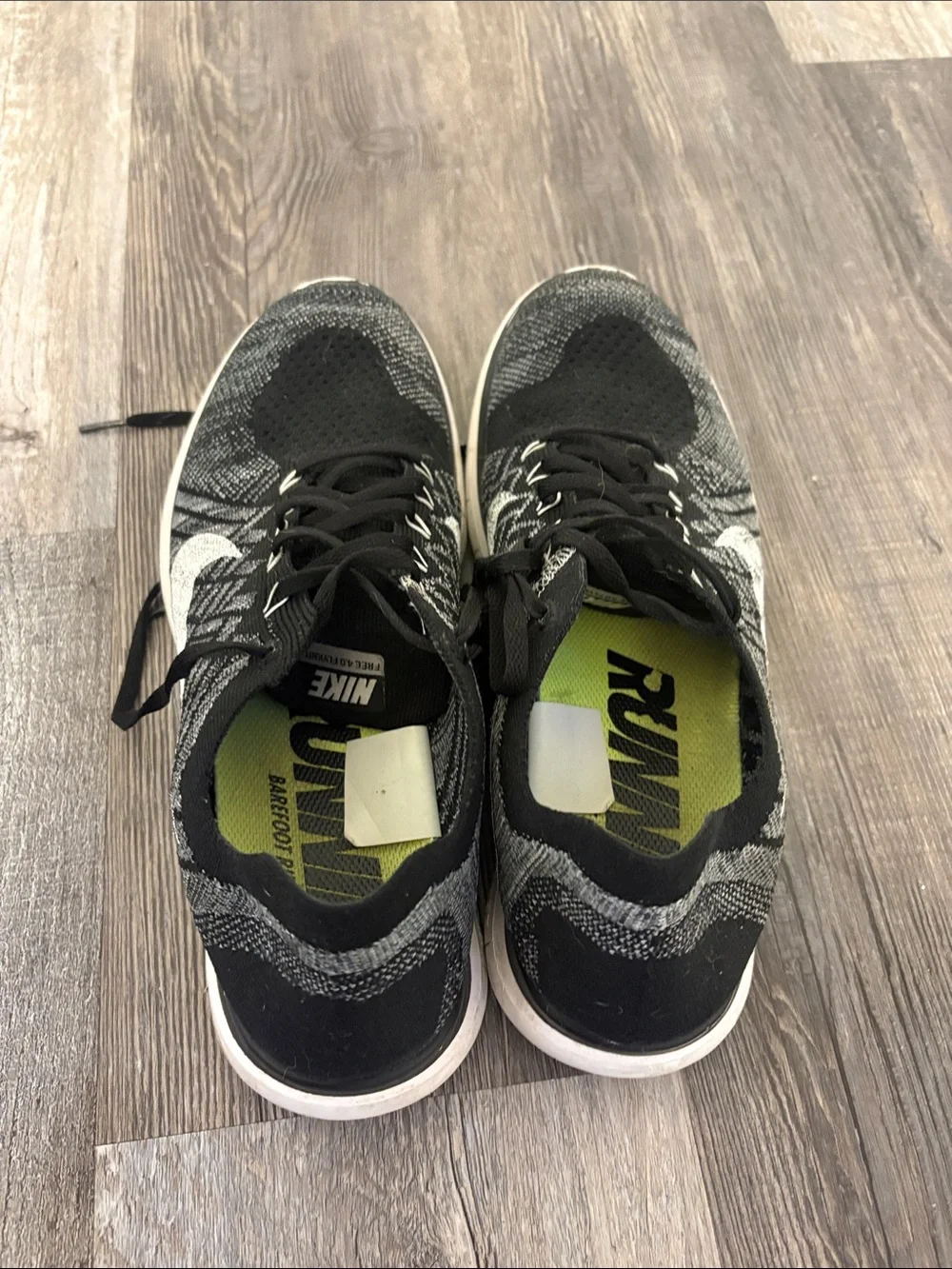 Nike Men’s Black and White Flyknit Athletic Sneakers